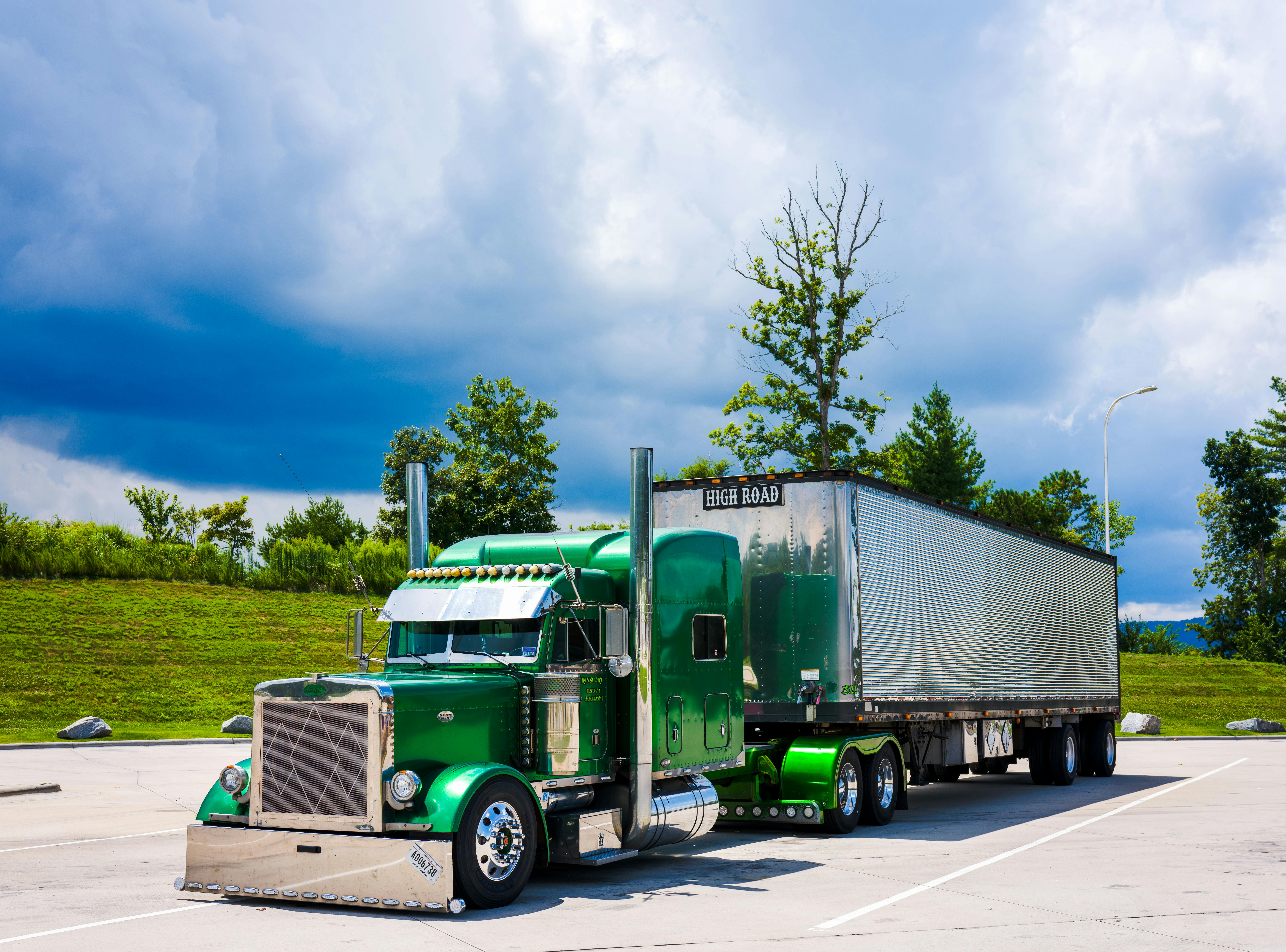 Dispatcher reviewing freight rate data and broker payment patterns
