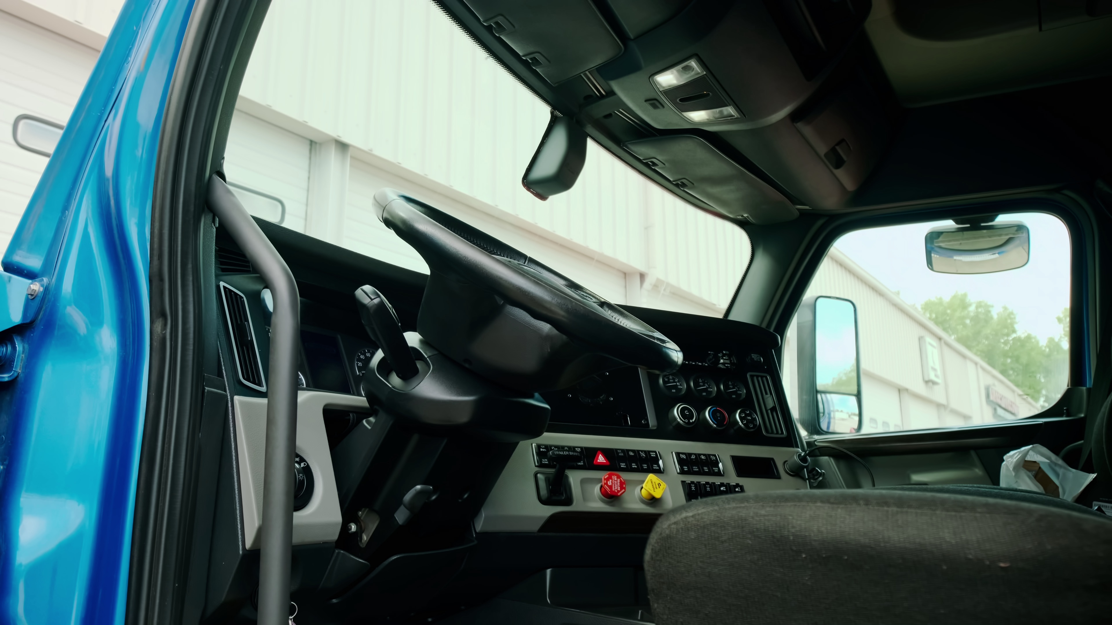 Class 8 truck cab in a parking lot
