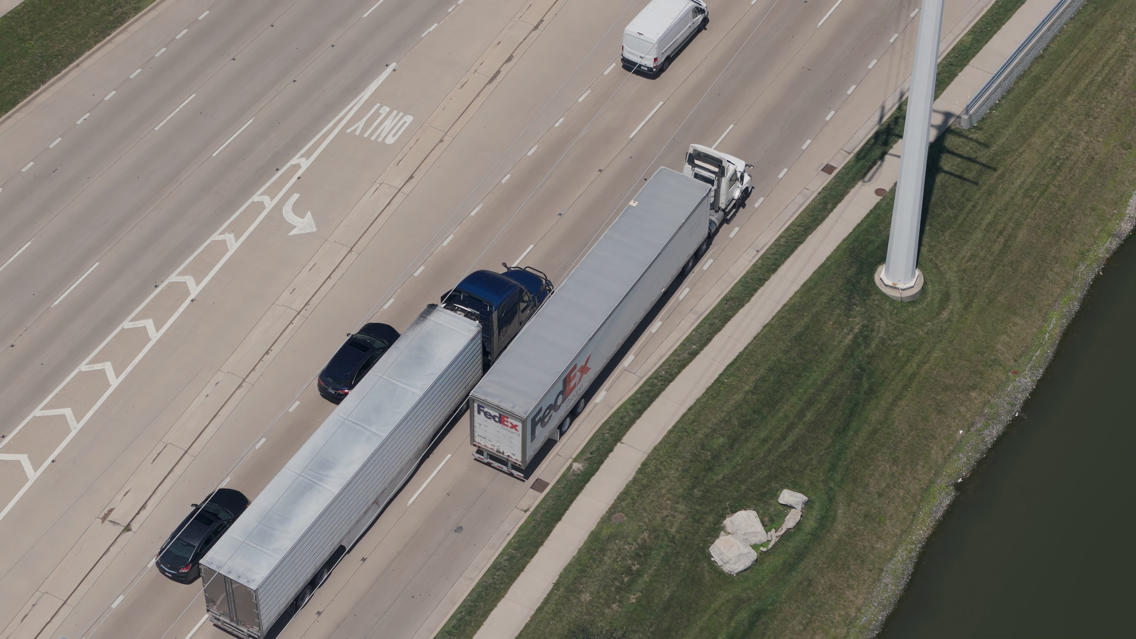 Aerial view of a delivery truck driving on a U.S. highway