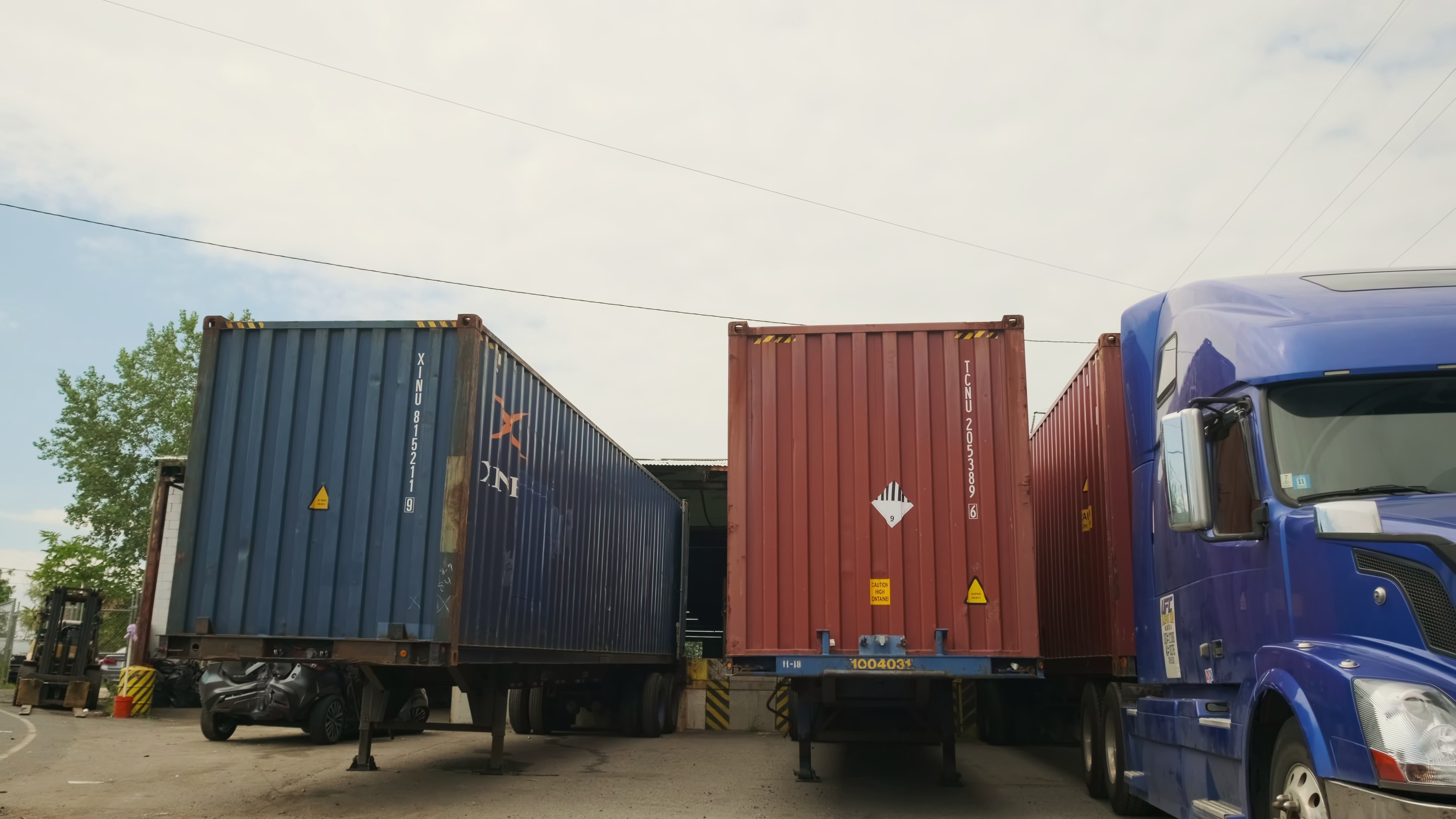 Industrial warehouse loading dock where trucks and trailers load and unload freight